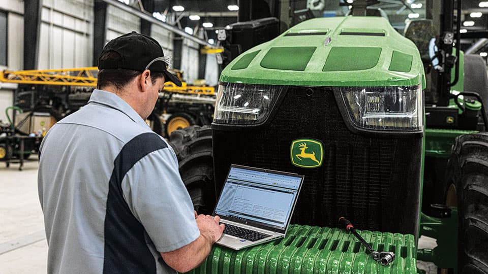 Technician servicing equipment